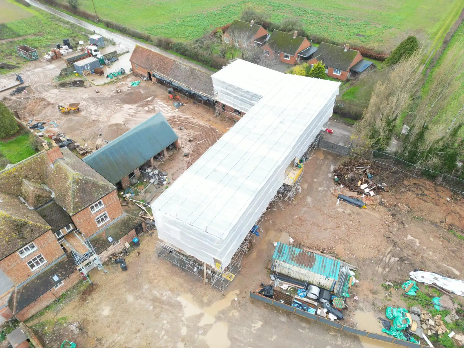 Aerial view of temporary roof scaffolding over a large building project